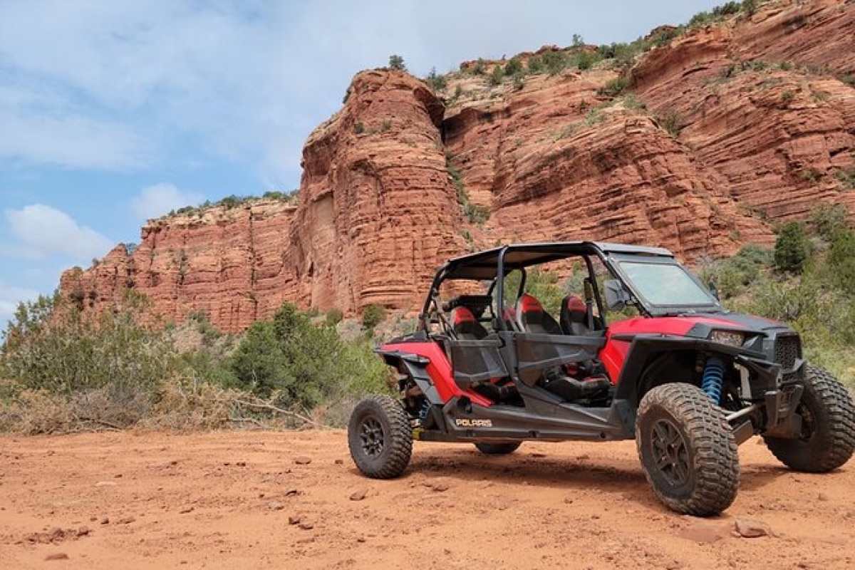 Off-road side-by-side in red rock canyon